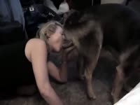 Hot chick takes in a huge dog dick from behind